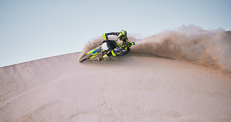 Image showing Bike, sand and space with a sports man riding a vehicle in the desert for adventure or adrenaline. Motorcycle, training and dust with an athlete on mockup in nature for power or active competition