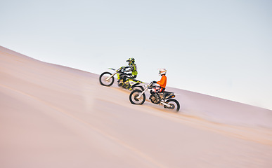 Image showing Dune, off road race and men on motorbike together for practice, training and extreme sports energy. Professional dirt biking challenge, friends and danger with motorcycle competition on desert hill.