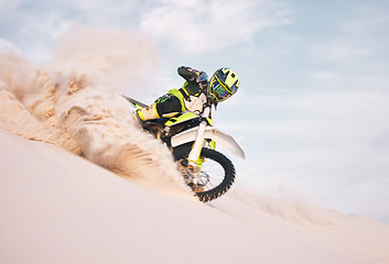 Image showing Desert, motorbike and person with sports, ride and journey with freedom, training for competition and challenge. Outdoor, driver and rider practice, extreme action and balance on bike on sand dunes