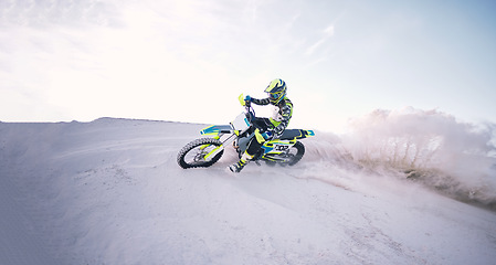 Image showing Motorcycle, sand and mockup with a sports man riding a vehicle in the desert for adventure or adrenaline. Bike, training and space with an athlete outdoor in nature for freedom, power or competition