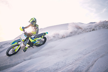 Image showing Bike, dust and speed with a man on space riding a vehicle in the desert for adventure or adrenaline. Motorcycle, training and mockup with an athlete on sand in nature for freedom or extreme sports