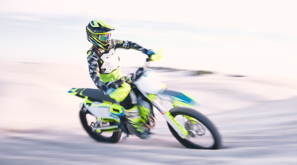 Image showing Bike, sand and speed with a sports man riding a vehicle in the desert for adventure or adrenaline. Motorcycle, training and freedom with an athlete outdoor in nature for power or active competition