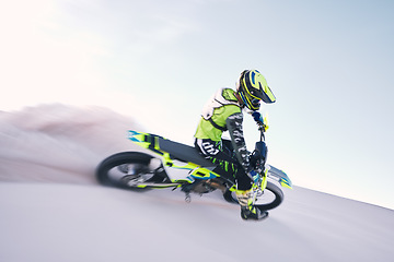 Image showing Bike, dust and speed with a sports man riding a vehicle in the desert for adventure or adrenaline. Motorcycle, training and freedom with an athlete on sand in nature for power or active competition