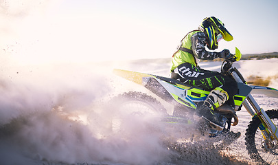 Image showing Bike, sand and dust with a sports man riding a vehicle in the desert for adventure or adrenaline. Motorcycle, freedom and training at speed with an athlete outdoor in nature for power or competition