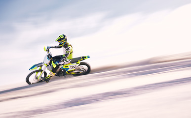 Image showing Bike, mockup and motion blur with a man on sand riding a vehicle in the desert for adventure or adrenaline. Motorcycle, freedom and training on space with an athlete on space in nature for power