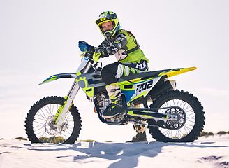 Image showing Sports, desert and portrait of man on motorbike for race training, workout and challenge on sand. Extreme transport, travel and male cyclist with motorcycle for adventure, freedom and adrenaline