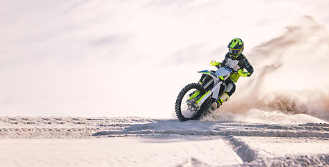 Image showing Bike, dust and mockup with a sports man riding a vehicle in the desert for adventure or adrenaline. Motorcycle, space and training at speed with an athlete outdoor in nature for freedom or power