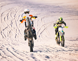 Image showing Dune, desert race and men on motorbike together for practice, training and extreme sports energy in nature. Professional dirt biking challenge, friends and danger with off road motorcycle competition