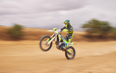 Image showing Speed, nature and a person on a motorbike for a race, travel or freedom in sports. Cycling, power and a man or professional driver with energy on a bike while driving for a challenge on a course