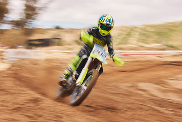 Image showing Dirt, motion blur and motorbike cycling for sports, agile driving and off road adventure for speed, power or performance. Motorcycle, rally and driver in fast race, challenge or action on sand course