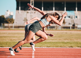 Image showing Action, sports and athlete running sprint in competition or fitness game or training for energy wellness on track. Race, stadium and athletic people or runner exercise, speed and workout performance