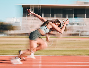 Image showing Action, race and women athlete running a sprint in competition or fitness game training as energy wellness on track. Sports, stadium and athletic person or runner exercise, speed and workout