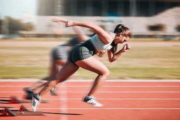 Image showing Action, speed and women athlete running sprint in competition for fitness game and training for energy wellness on a track. Sports, stadium and athletic people or runner exercise, speed and workout