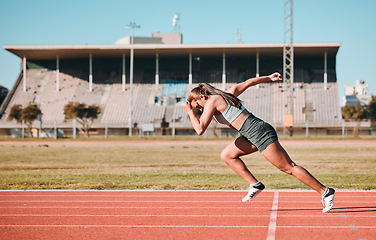 Image showing Sports, race and woman athlete running sprint in competition for fitness game or training as energy wellness on a track. Fast, stadium and athletic person or runner exercise, speed and workout