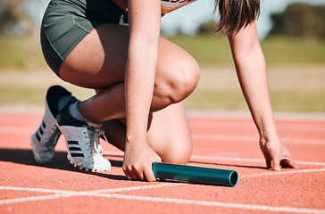 Image showing Start, running and relay with hands of person on race track with baton for sports, competition and marathon. Exercise, health and wellness with closeup of runner in stadium for challenge and athlete