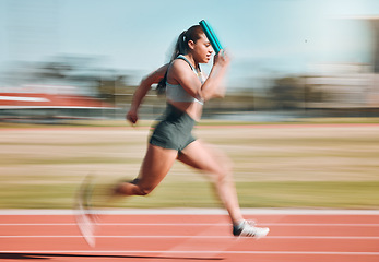 Image showing Action, speed and woman athlete running relay sprint in competition for fitness game and training for energy wellness on a track. Sports, stadium and athletic person or runner exercise and workout