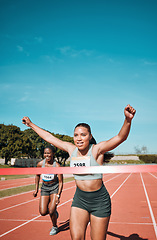 Image showing Happy woman, running and winning by finish line in race, competition or marathon on outdoor stadium track. Female person or runner in celebration for victory, achievement or sports accomplishment