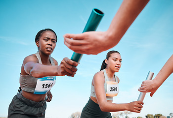 Image showing Woman, teamwork and baton in relay, running competition or sports fitness on stadium track. Active people or athlete passing bar in competitive race, sprint or coordination for team performance