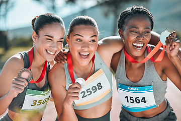 Image showing Happy women, award and celebration in olympic winning, running or competition together on stadium track. Group of athletic people smile in happiness, medal or victory in sports marathon or success