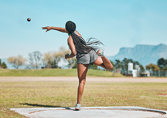 Image showing Shot put, woman and athlete throw in competition, championship or training for field event with metal or steel weight. Throwing, ball or female in athletics sport on outdoor field for olympics