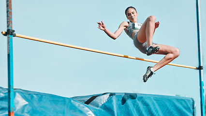 Image showing High jump, woman and fitness with exercise, sport and athlete in a competition outdoor. Jumping, workout and training for performance with action, energy and contest with female person and athletics