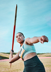 Image showing Woman, javelin and olympic athlete in competition, practice or sports training in fitness on stadium field. Active female person or athletic competitor throwing spear, poll or stick in distance