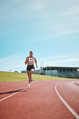 Image showing Woman, athlete and running on stadium track in fitness, workout or cardio exercise for practice or training. Female person or runner in sports competition, performance or outdoor motivation on mockup