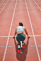 Image showing Start, running and fast with woman on race track for sports, competition and marathon. Exercise, health and wellness with runner training in stadium for challenge, speed and energy performance