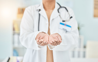 Image showing Palm, healthcare and hands of a doctor for help, support or charity at a hospital. Closeup, work and a nurse or surgeon with a gesture for donation, prayer or faith at a clinic for medical trust