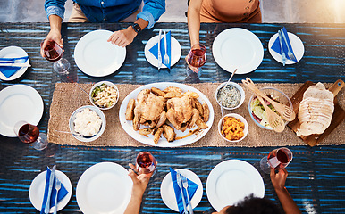 Image showing Wine, food or top of friends in restaurant to relax on holiday vacation at a party event together. Food, group celebration or hands of people eating chicken at table for lunch, dinner or brunch meal