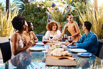 Image showing People, food and friends outdoor at a table for social gathering, happiness and holiday celebration. Diversity, men and women group eating lunch at party or reunion with drinks to relax in a garden