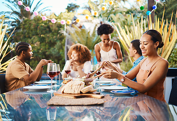 Image showing Friends, food and celebration, lunch in garden and happy event with diversity, conversation and wine. Outdoor dinner, men and women at table, group of people eating with drinks in backyard in summer.