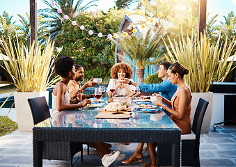 Image showing Group of friends at lunch, fun in garden and happy event with diversity, food and wine, outdoor bonding together. Dinner party, men and women at table, people eating with drinks in backyard in summer