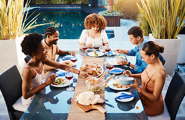 Image showing Group of friends at lunch, party in garden and happy event with diversity, food and wine for bonding together. Outdoor dinner, men and women at table, people eating with drinks in backyard in summer.