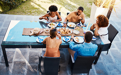 Image showing Food, top and people in house backyard to relax on holiday celebration or vacation in summer together. Party, home or happy friends eating to bond at table in conversation for lunch or brunch meal