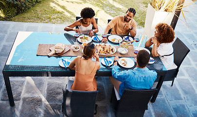 Image showing Food, top and friends in house backyard to relax on holiday celebration or vacation in summer together. Party, home or happy people eating to bond at table in conversation for lunch or brunch meal