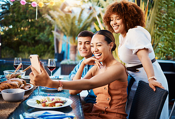 Image showing Friends, food and selfie at outdoor table for holiday, Christmas or thanksgiving on social media. Young women, man or group with photography or influencer profile picture for happy brunch celebration