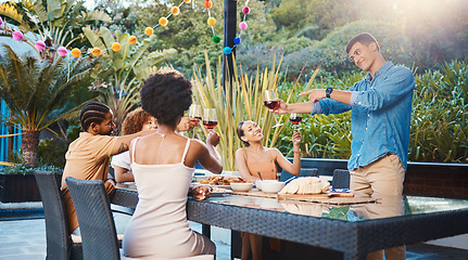 Image showing Cheers, celebrate, and friends at dinner in garden at party and diversity, food and wine at outdoor event. Glass toast, men and women at table, fun people with sunset drinks in backyard together.