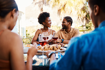 Image showing Wine, happy and friends at outdoor restaurant to relax on holiday vacation in summer together. Food, smile or black people eating or bonding at table in conversation on date for lunch or brunch meal