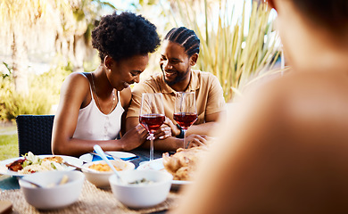 Image showing Conversation, friends at dinner in garden at party and celebration with diversity, food and wine at outdoor lunch Eating, men and women at table, fun people talking with drinks in backyard together.