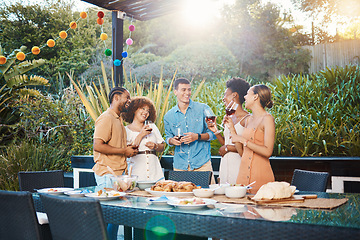 Image showing Smile, diversity and friends at lunch in a garden with drinks, conversation and talking at a party. Happy, alcohol and group of men and women at an outdoor backyard dinner with communication