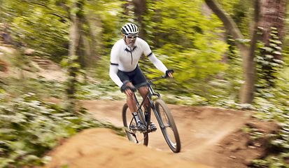 Image showing Nature cycling, bicycle and sports man travel, ride and journey on off road path, outdoor challenge or exercise. Fast mountain bike, speed blur and athlete training, fitness and workout in forest