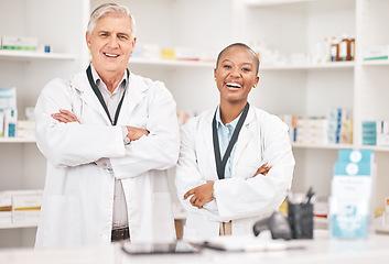 Image showing Portrait, smile and arms crossed for pharmacy with a team in a drugstore for healthcare or treatment. Medical, collaboration or teamwork with a man and woman pharmacist happy a dispensary together