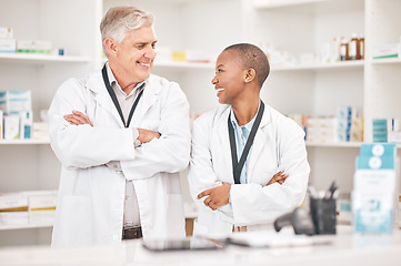 Image showing Medical, smile and arms crossed for pharmacy with a team in a drugstore for healthcare or treatment. Medicine, collaboration or teamwork with a man and woman pharmacist happy a dispensary together