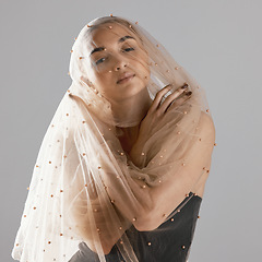 Image showing Portrait, creative and a woman with a veil on a studio background for a wedding or aesthetic. Fashion, model and a young girl with clothes for creativity, elegant and classy isolated on a backdrop