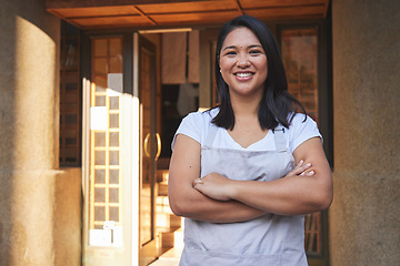 Image showing Portrait, waitress and Asian woman with arms crossed at restaurant, coffee shop or store. Face, smile and confident barista, happy employee or small business entrepreneur at cafe startup in Cambodia