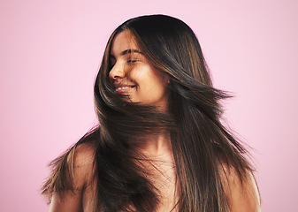 Image showing Hair care, smile and woman shaking head in studio, luxury salon treatment and shine with texture. Healthy haircare wellness, beauty aesthetic and cosmetics, happy girl with glow and pink background.