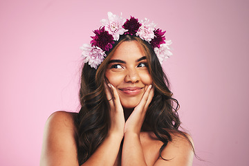 Image showing Beauty, flowers and crown on hair of woman in studio for cosmetics, skincare and wellness. Self care, spa treatment and plant with face of person on pink background for spring, glow and makeup