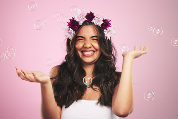 Image showing Beauty, flowers and bubbles with portrait of woman in studio for cosmetics, skincare and wellness. Hair care, spa treatment and crown with person on pink background for spring, glow and makeup