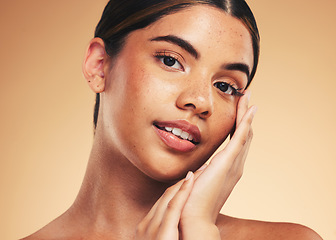 Image showing Skincare, beauty and portrait of woman with hands for wellness, health and facial care in studio. Dermatology, spa and person on brown background in cosmetics, natural face and touch for satisfaction